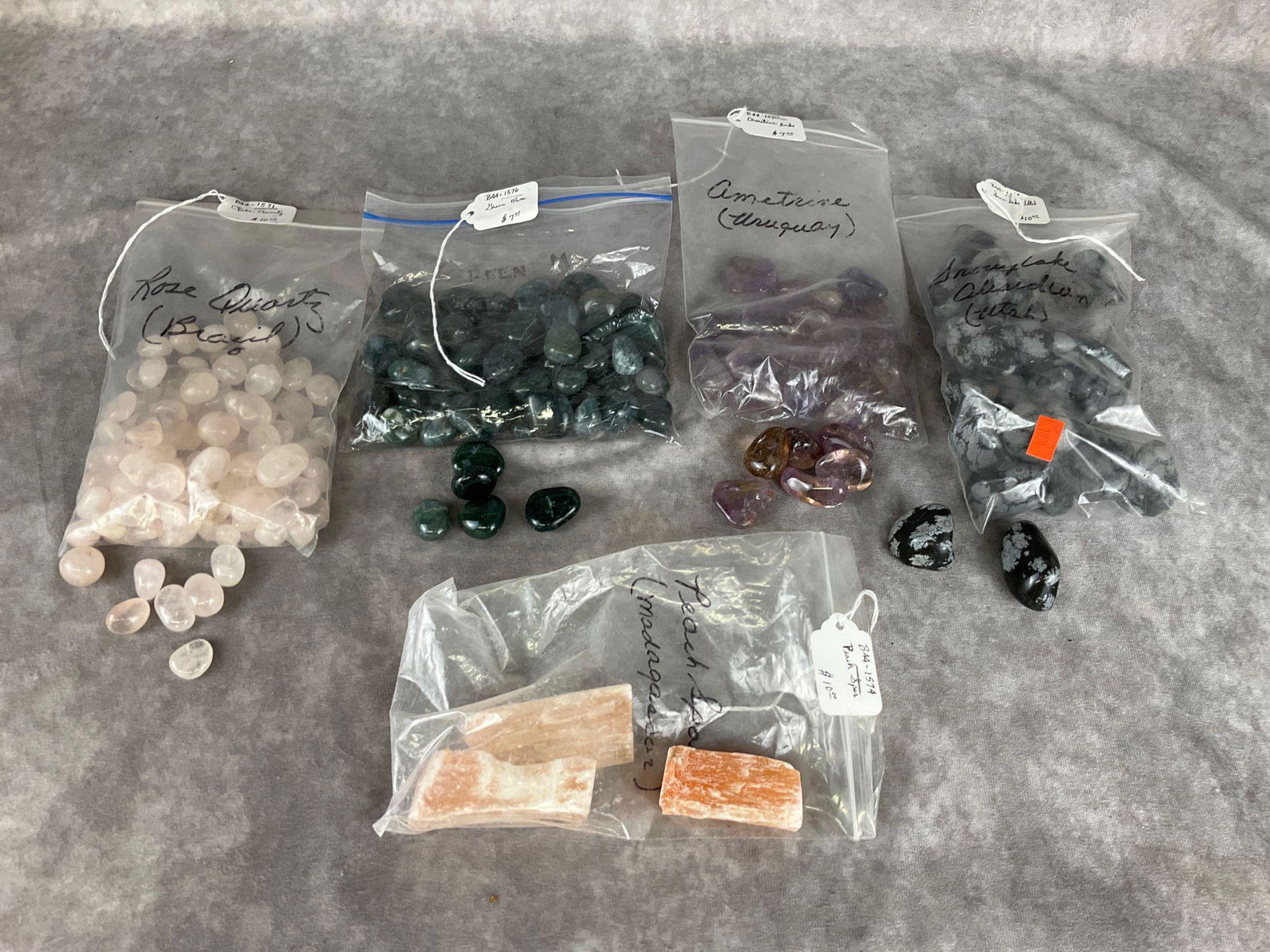 Tumbled Gemstones: Four bags of tumbled Rose Quartz, Ametrine, Snowflake Obsidian, Green Moss Agate. One bag of Peach Spar chunks.