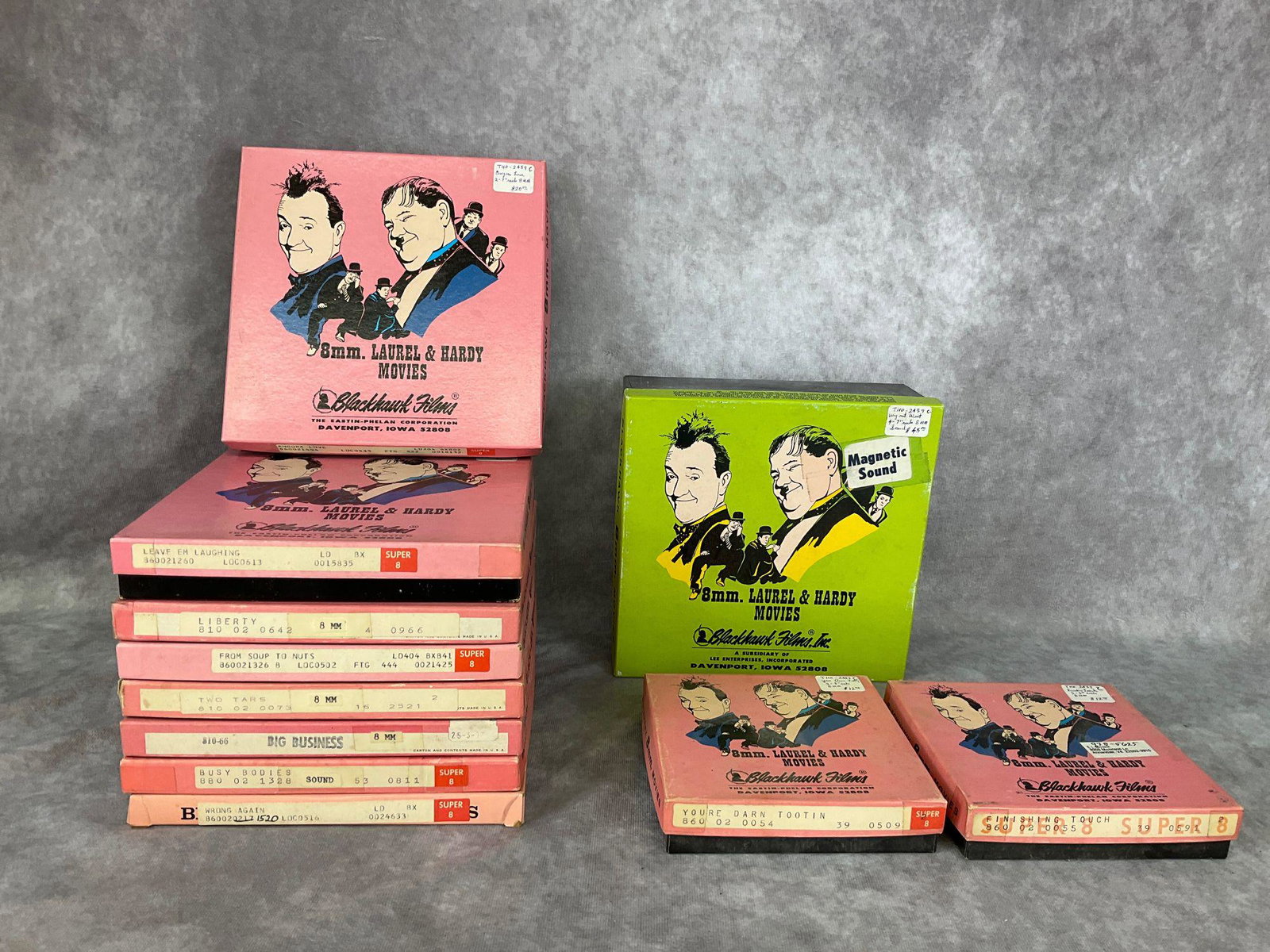 Laurel & Hardy 8 MM Movie Collection: One reel shows mildew, others in good condition. No vinegar smell noted. Contents not checked to match boxes. Some wear to boxes.