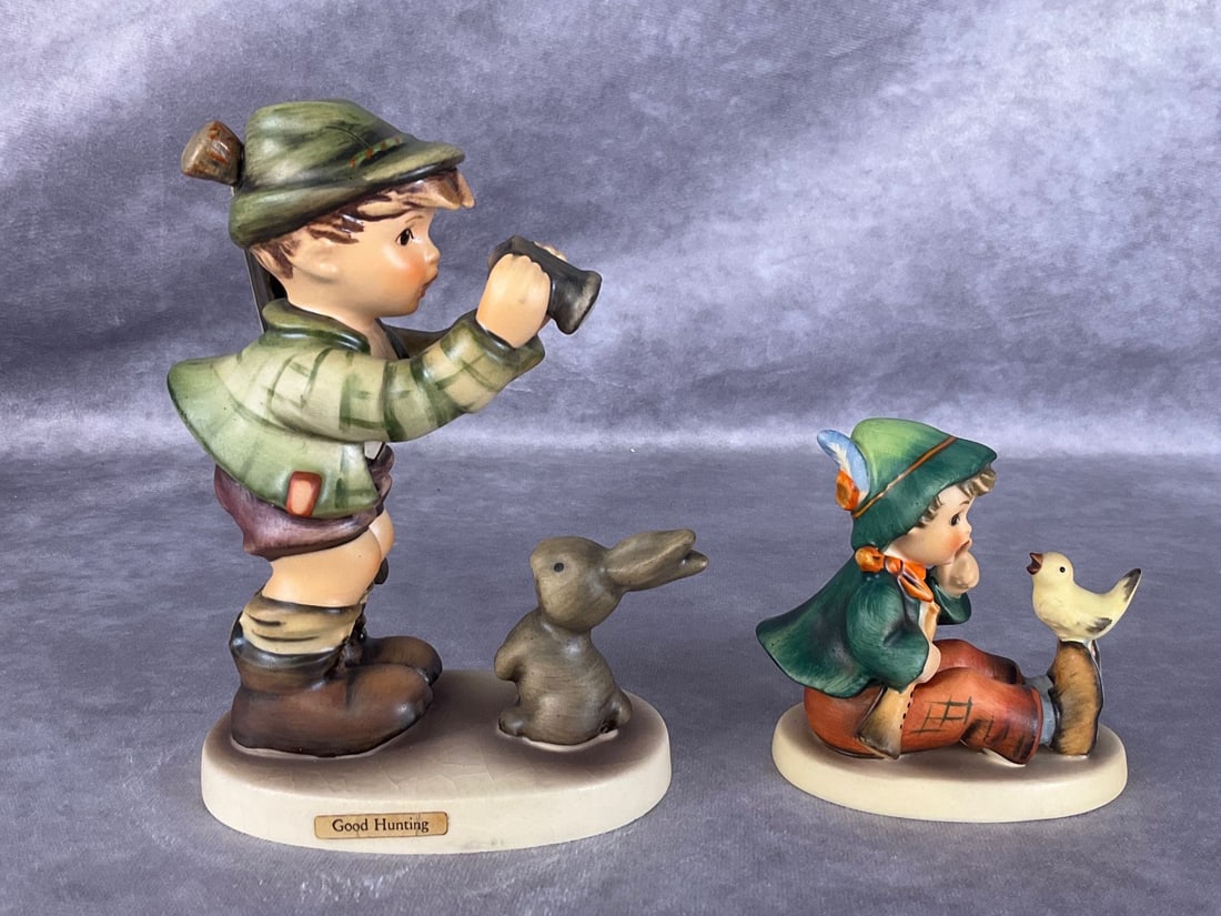 Hummel Figurines: Singing Lesson and Good Hunting. Crazing to base of Good Hunting, otherwise good. Tallest is 5.25 inches.