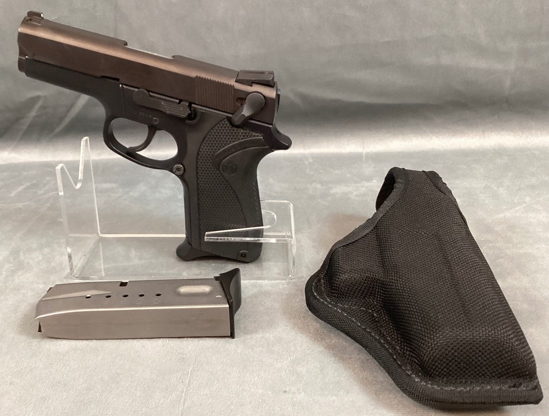 Smith and Wesson Model 6904 Pistol in 9MM Parabellum: Serial# VAV2063. 99% finish. Bore and grips are excellent. Includes holster and extra magazine. Barrel 3 1/2" Overall 7" Registration Required