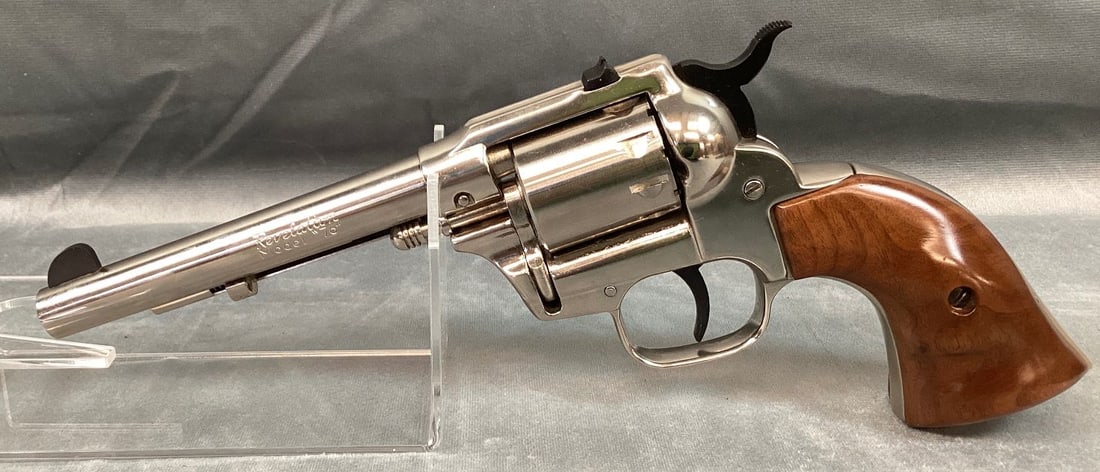 Western Auto Revelations Model "œ76" Revolver in .22: Serial# 2378077. 98% nickel finish with a few scratches. Bore is very good. Grips are very good with minor wear and scratches. Includes holster. Barrel 5 1/2" Overall 10 1/2" Registration Required