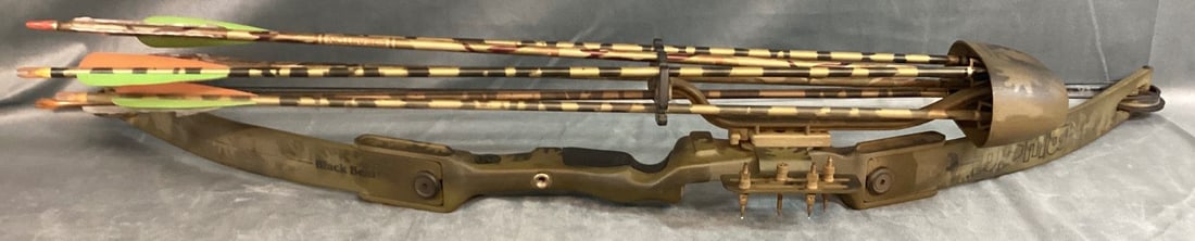 Black Bear Compound Bow with Quiver: 30" draw and 55 pound draw weight. Wear from use and the broad head arrows have damaged ends. 45" tall.