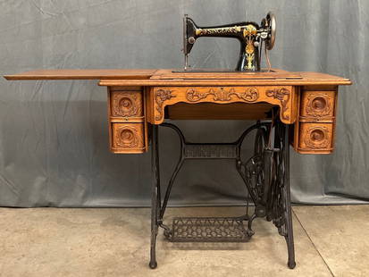 Early 20th C. Singer Sewing Machine: Has been cleaned and is in very good condition for age. Serial number B1009397 dates it to April 4, 1905. Includes accessories in drawer. Dimensions when closed are 36 inches wide x 18 inches x 30.5 i