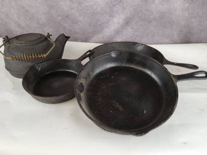 Cast Iron Skillets and Kettle: Griswold 5 . 10 5/8 and 12.5 inch appear to be unmarked. Kettle is 11 inch to top of handle. Rust and pitting but all are in fair to good condition.