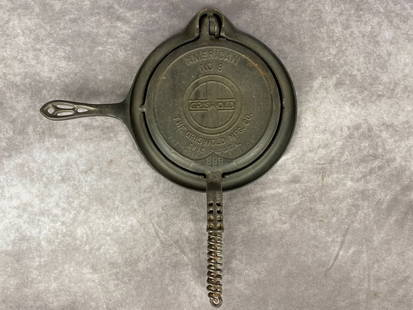 Griswold Waffle Iron: The American no. 8 patent dated Dec. 1,1909 with 975 low trivet base. Overall good condition with minimal rust.