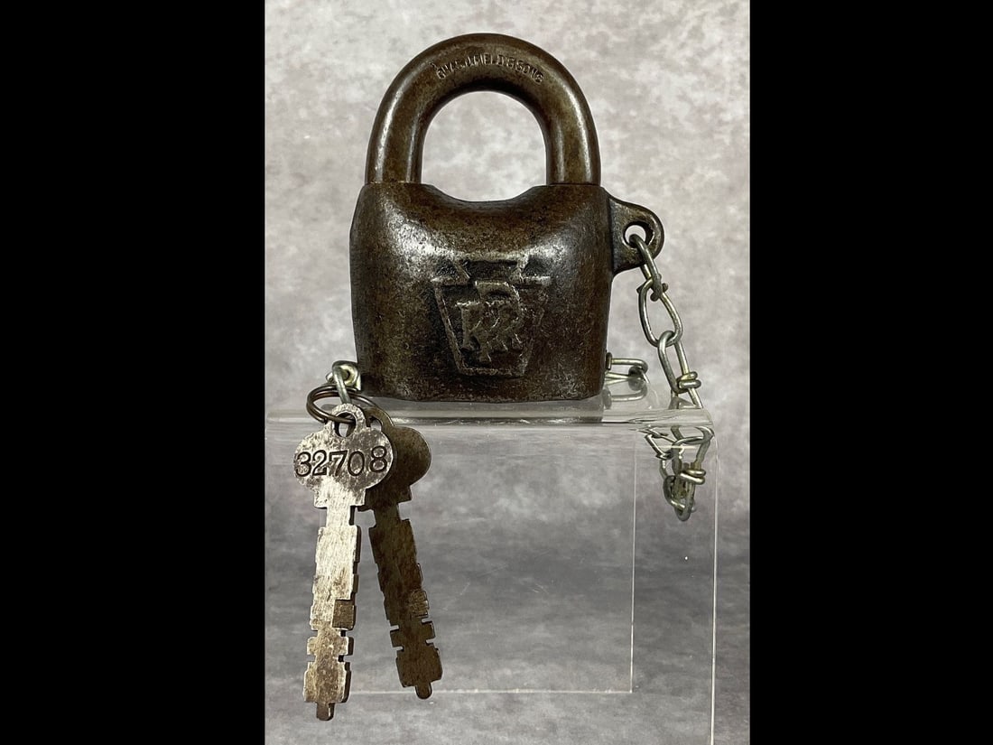 Pennsylvania Railroad Lock: With two keys. Keystone PRR emblem on lock. Made by Chas. J.Field and Sons. Serial number on back is 32708 F. Both keys are stamped with that serial. Good condition but has been cleaned. 2.5 inches wi