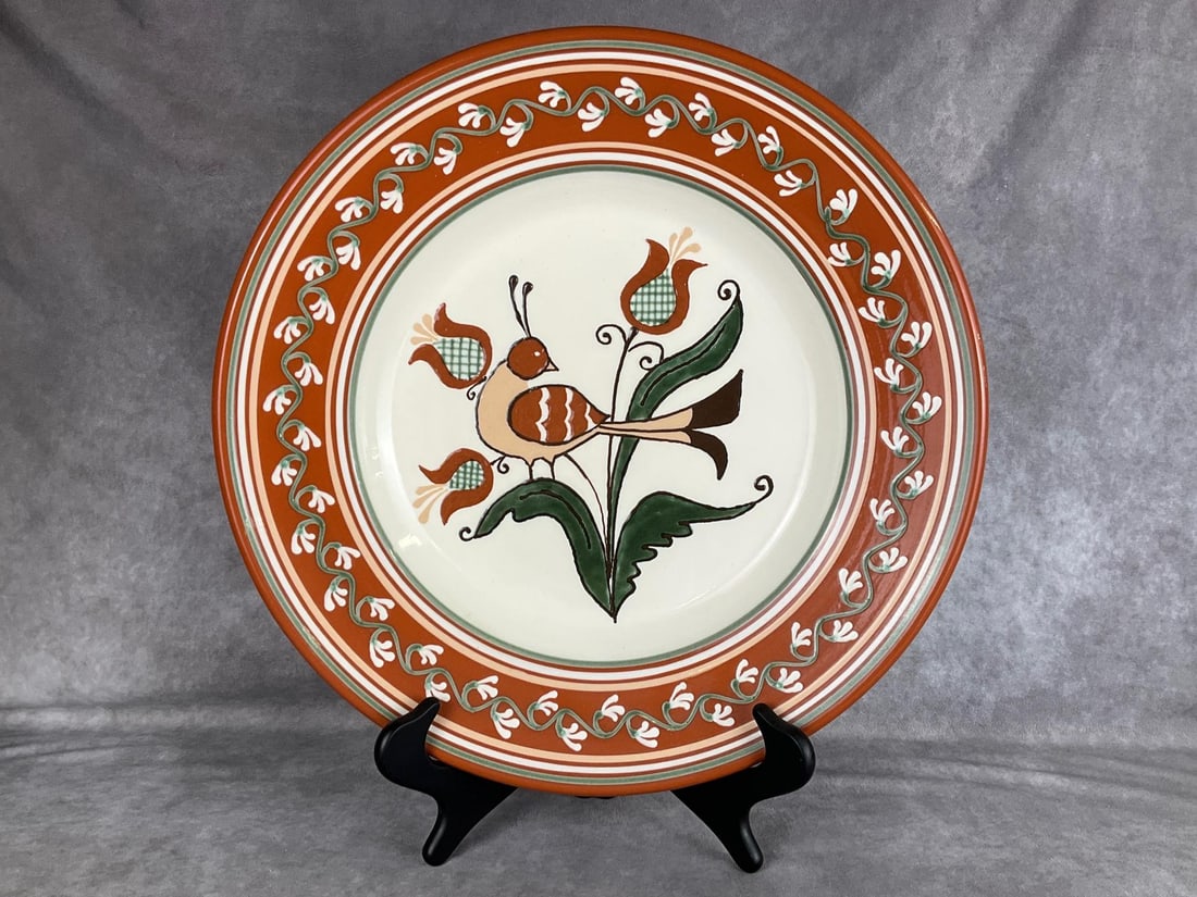 North Carolina Pottery Redware Charger: Slip decorated with bird amongst flowers. Made by H and E Pugh of New Salem, NC. 16.25 inches wide. Very good condition, includes stand.