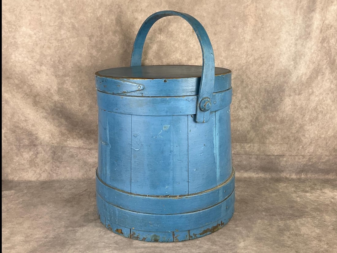 Country Blue Painted Wooden Firkin Bucket: Some chipped paint, and minor moisture stains to the base. 12 inches wide x 17 inches tall including handle.