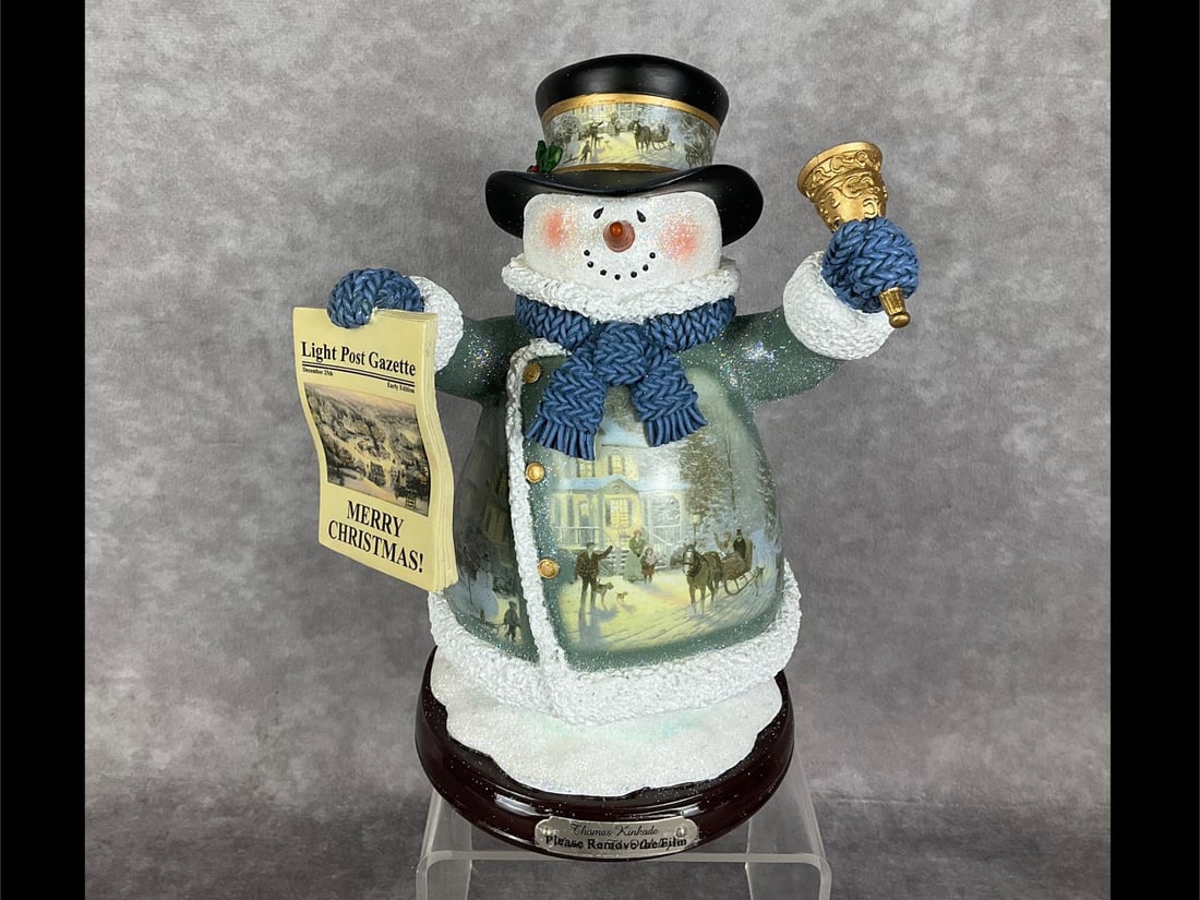 Thomas Kinkade Snowman: Home For The Holidays Snowman from 2004. Third issue in the Thomas Kinkade Winter Wonderland Heirloom Classics Snowman Collection with The Bradford Exchange. No. B7074. New with styrofoam packaging. H