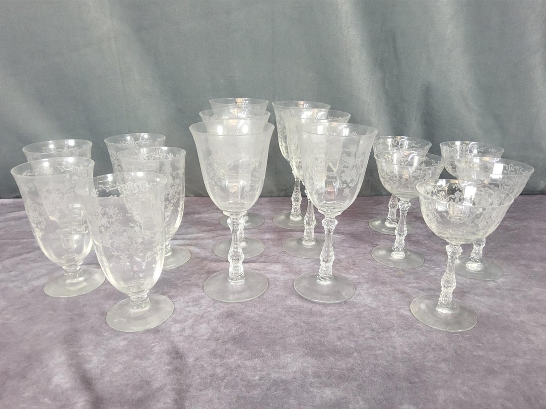 Fostoria Navarre Stemware: Etched crystal. Six 7.75 inch water goblets, five 6 inch iced tea glasses and five 5.75 inch champagne sherbet glasses. All are in good condition.
