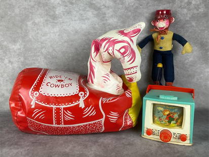 Mid 20th Century Toys: Fisher Price Peek-A-Boo Screen nursery rhyme 6 inch winding toy, made in Japan 12.5 inch tall monkey bellhop doll, and rubber blow-up Ride "?Em Cowboy pony by Urb Plastics Corp. 16 x 9 x 18 inches. Al