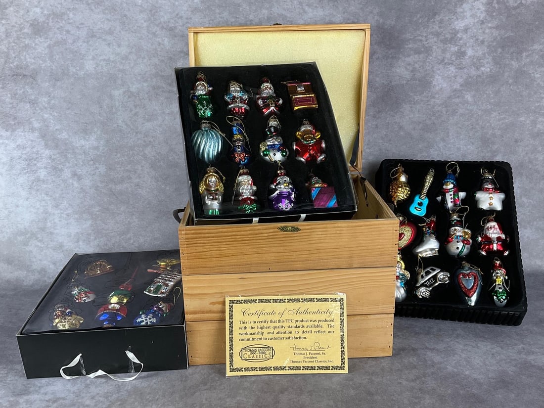 Pacconi Christmas Ornament Collection: Thomas Pacconi Classics wooden box with three trays of blown glass ornaments from their Museum Series. Includes 31 ornaments total, with C.O.A. Good condition. Box dimensions 13 x 10 x 11.5 inches tal