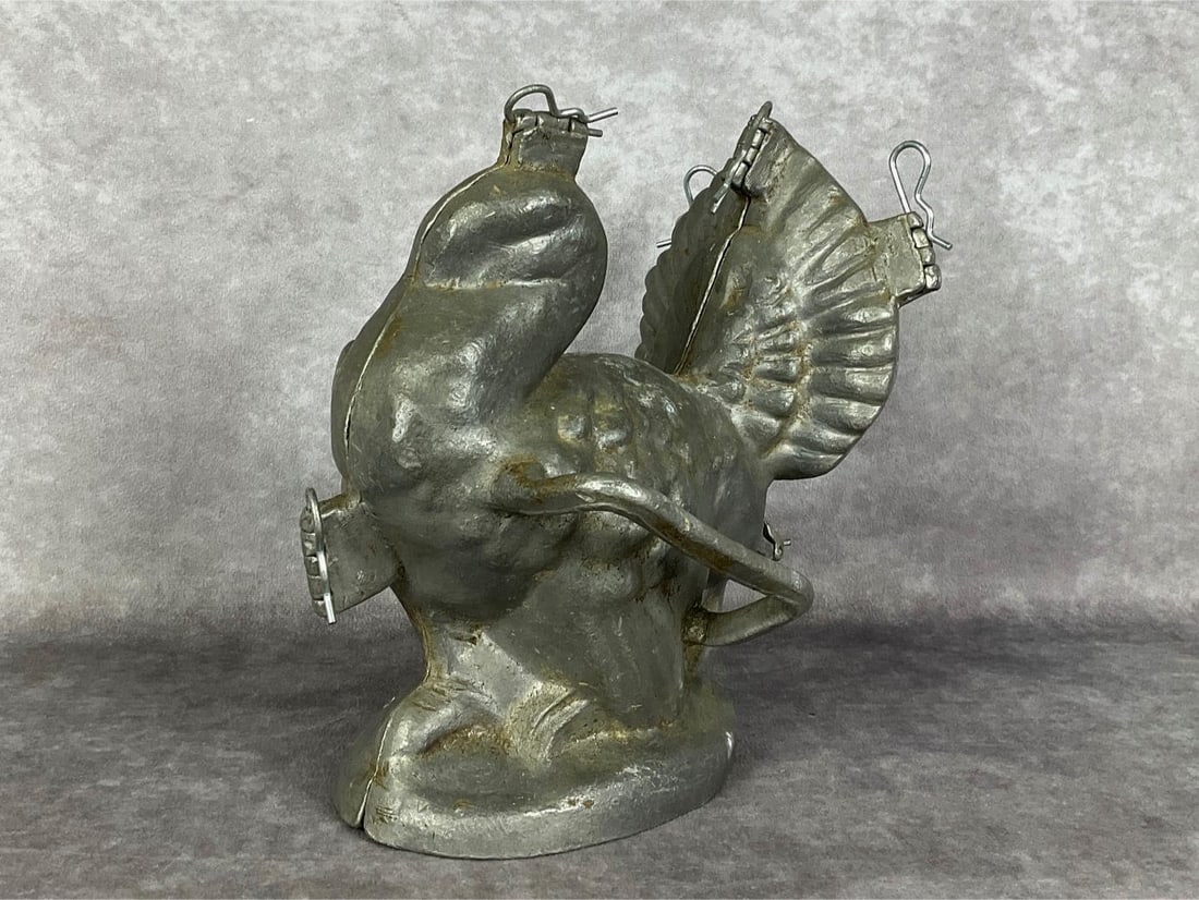 Antique Pewter Ice Cream Turkey Mold: Marked 6 E and Co. on his fantail for the Eppelsheimer Co. Piece has newer cotter pins. Good with wear. 6.5 inches wide including handles x 8 x 8.5 inches tall.