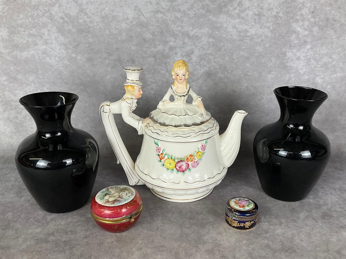 Vanity Decor: Handpainted porcelain musical teapot, made in Japan, that intermittently plays Tea for Two, in cosmetically overall good condition with some crazing. 8.5 inches tall. Along with pair of amethyst glass