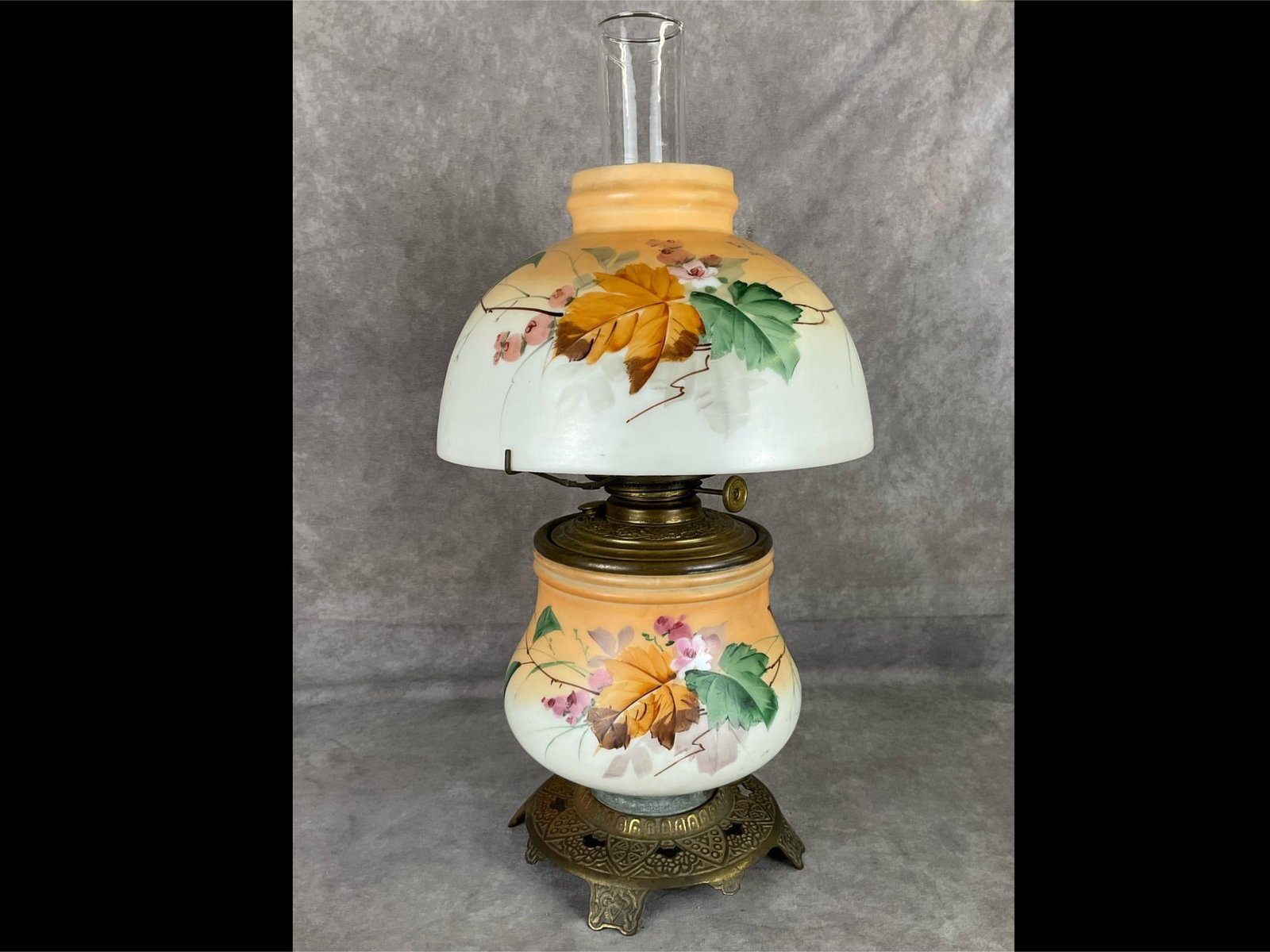 Hand Painted Garden Currant Parlor Oil Lamp: 19th century. Burner marked IMPD Climax. Has not been converted. Design appears to be currants on the flowering shrub. Glass shade is 9.5 inches wide. Lamp height with glass chimney is 20 inches. Some