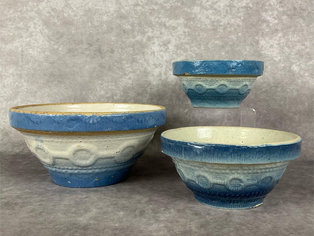 Wedding Ring Salt Glaze Bowls: Group of three in blue and white. Largest is 8 inches wide x 4 inches tall. There is an original flaw on the bottom that is covered with glaze. Some crazing with discoloration to the interior. Second