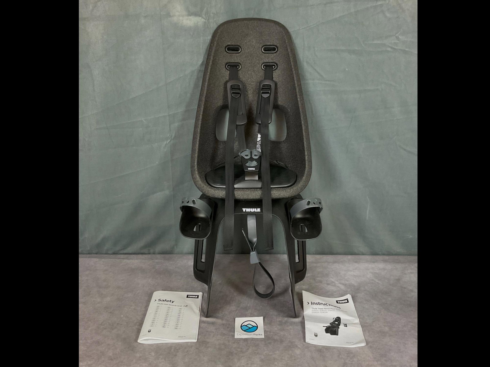 Child's Rear Bicycle Seat: Yepp Nexxt Maxi by Thule. Mod l 12080211. Belt is currently locked and the key is missing. Includes manual and sticker. Box damaged in shipping but appears seat itself only incurred minimal scuffing t
