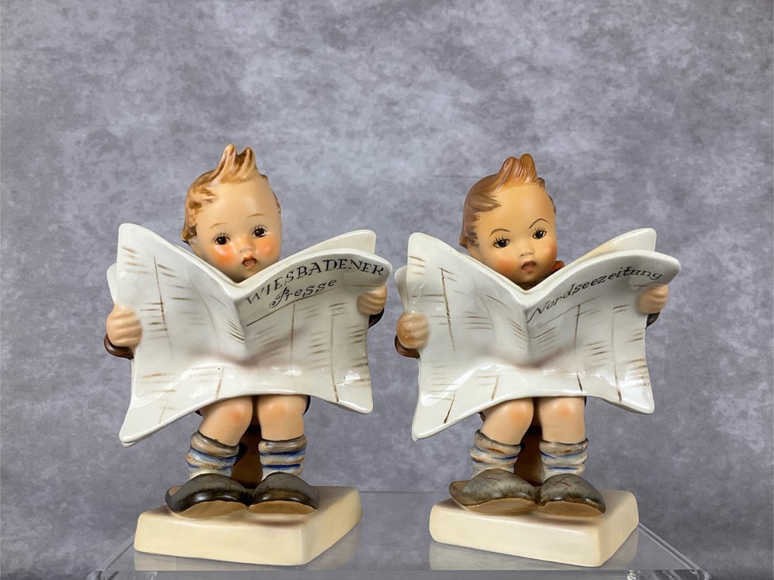 Two Latest News Hummels: Hum 184. TMK 3. First with headline: Wiesbadener Presse in good condition. Second, with headline Nordseezeitung appears to have been professionally repaired at neck; when inspected under UV light piec
