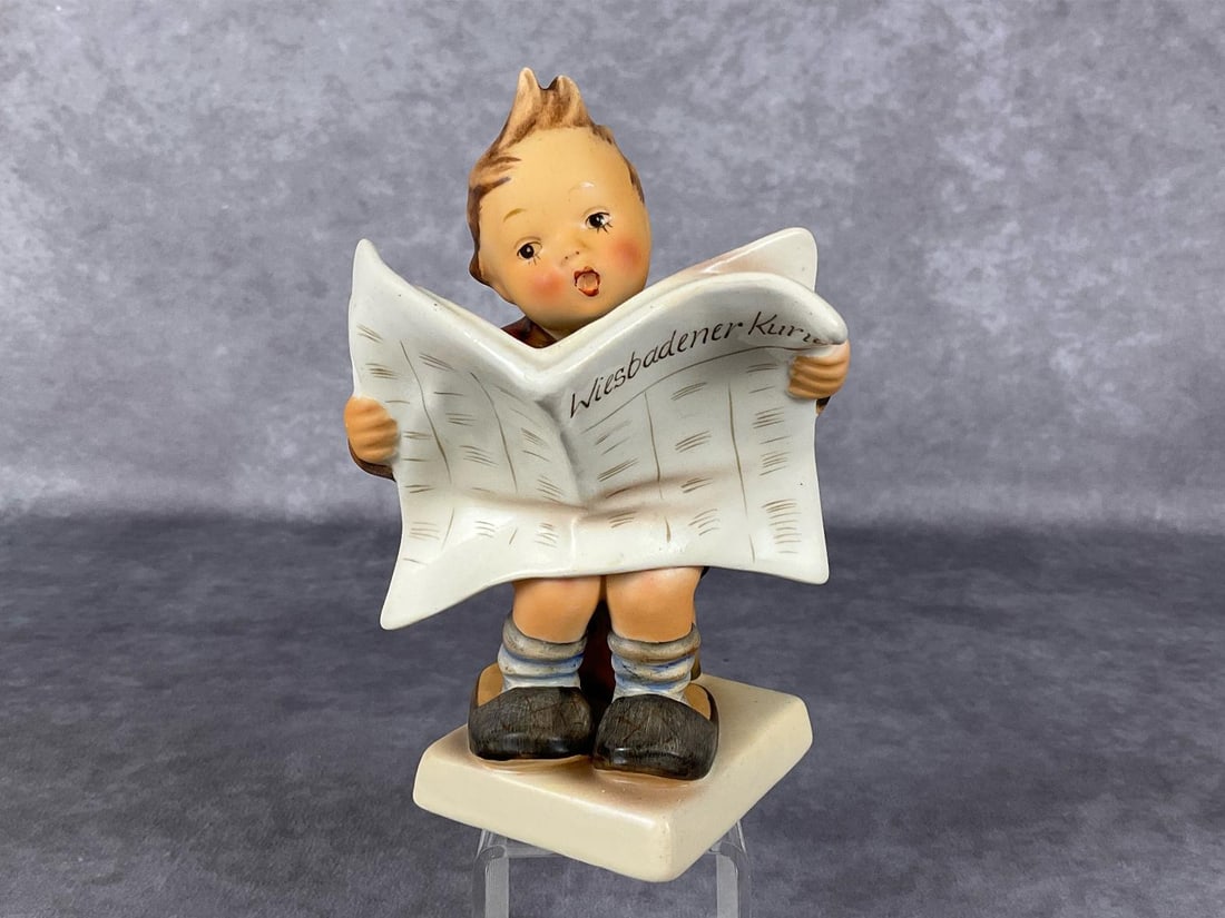 Latest News TMK 2: Hum 184. Headline reads: Wiesbadener Kurier. With high bee and (R) marks. Height of 5.25 inches. Good condition.