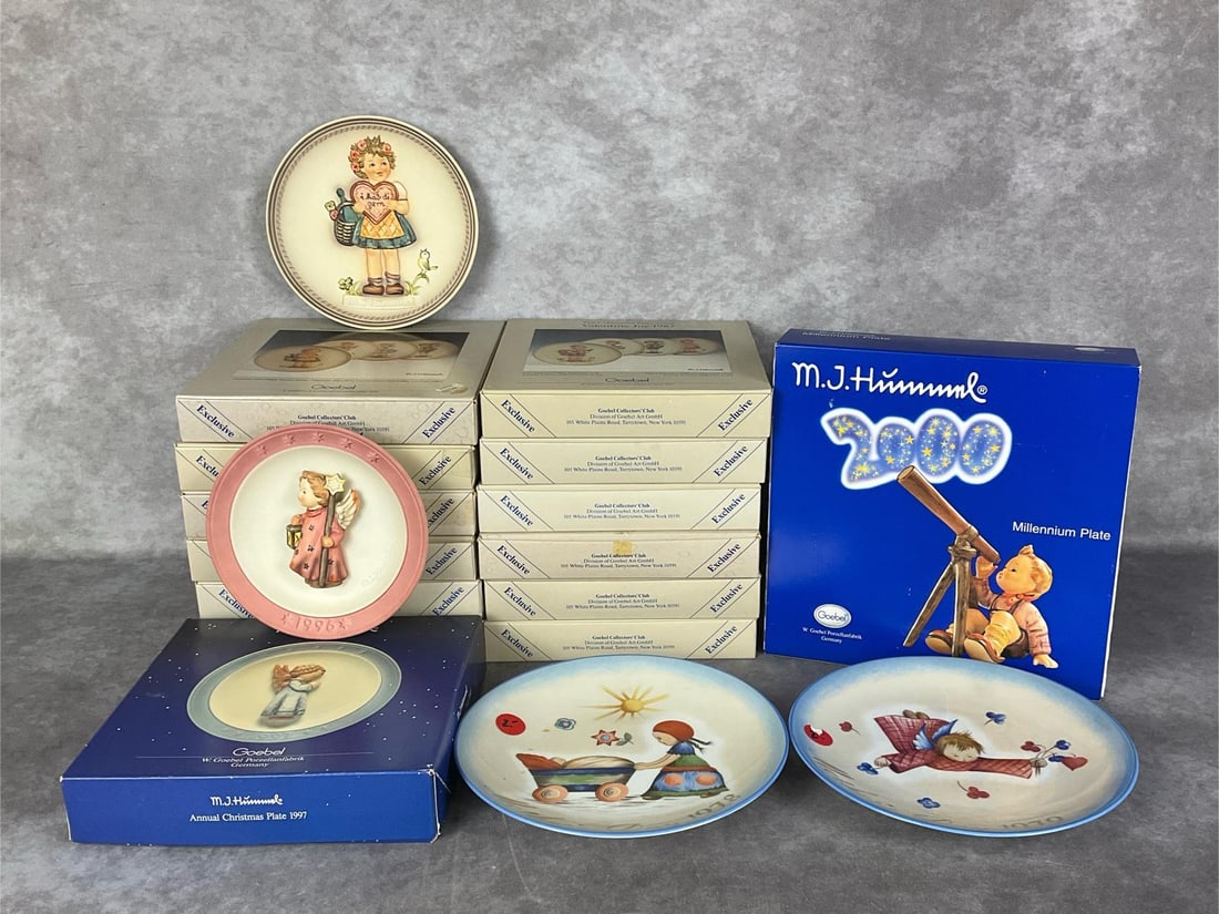 Goebel Celebration & Millennium Plates: Twelve boxed Goebel Collectors Club plates from the Celebration Series with duplicates; four of Daisies Don't Tell, four Valentine Joy 1987, three Valentine Gift, and one It's Cold 1989. Boxes are wor