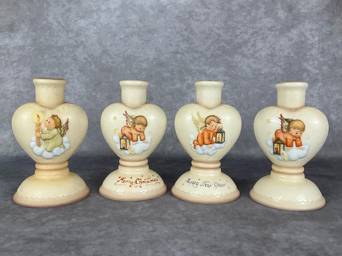 Four Hummel Candleholders: Three 3013 and one 3014. 5.75 inches tall. Minor shelfwear, overall good condition.