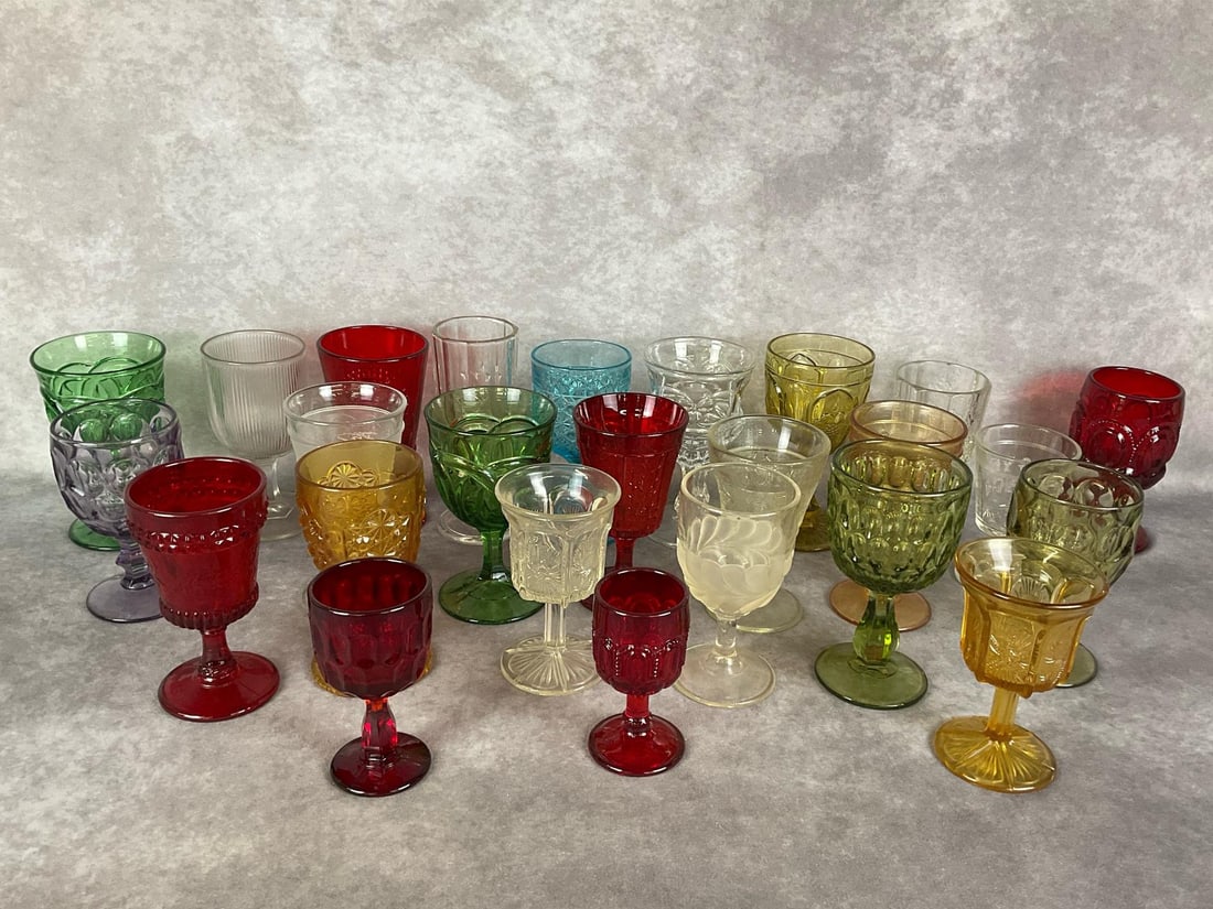 Rainbow of Glasses: Colorful and clear drinking goblets, mid to late 20th century. Tallest 7.25 inches. Good condition except peach log cabin glass is chipped as shown.
