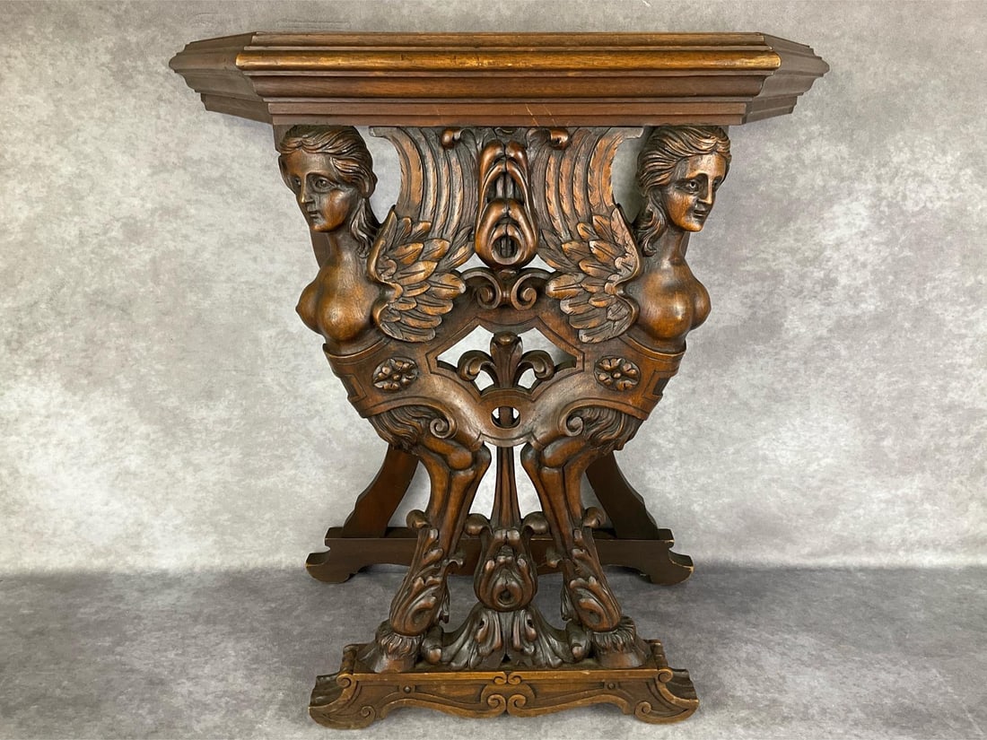 Belgian Mythological Nude Winged Woman Console Table: Early 20th century. Wooden frame is stamped Made in Belgium, Kiln Dried 64. Missing what would have presumably been a marble top. Featuring two bare breasted women with wings on cloven hooves. Good co