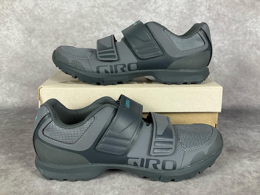 Giro Berm Cycling Women's Shoes: In Titanium/Dark Shadow CVR. Women's size 9.0. Minor to moderate soiling to uppers and soles, overall good condition. Includes original box with warehouse stickers.