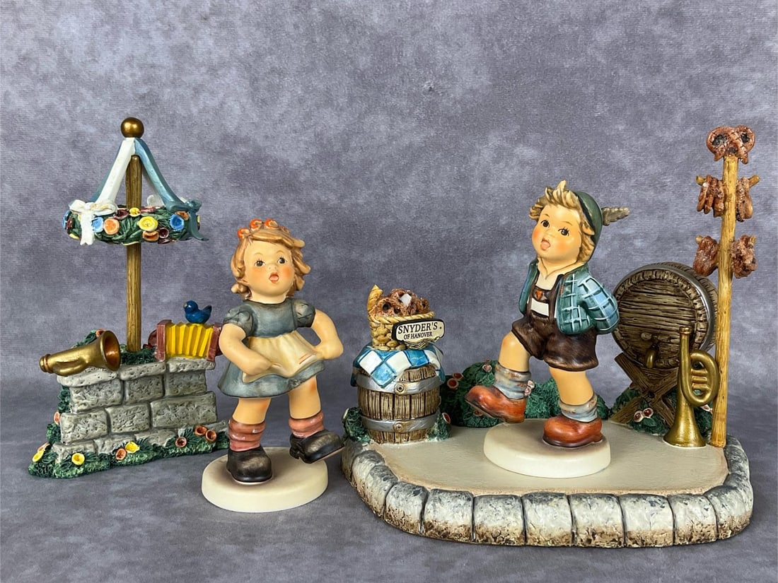 Alpine Dancer & Musik, Please Set: Hum 2108/A limited edition #05,677 and 2108/B limited edition #07,028 of 25,000; both TMK 8. Includes matching Hummelscape Markplatz #1065-D and Volksfest accessory. Markplatz is damaged: several pret