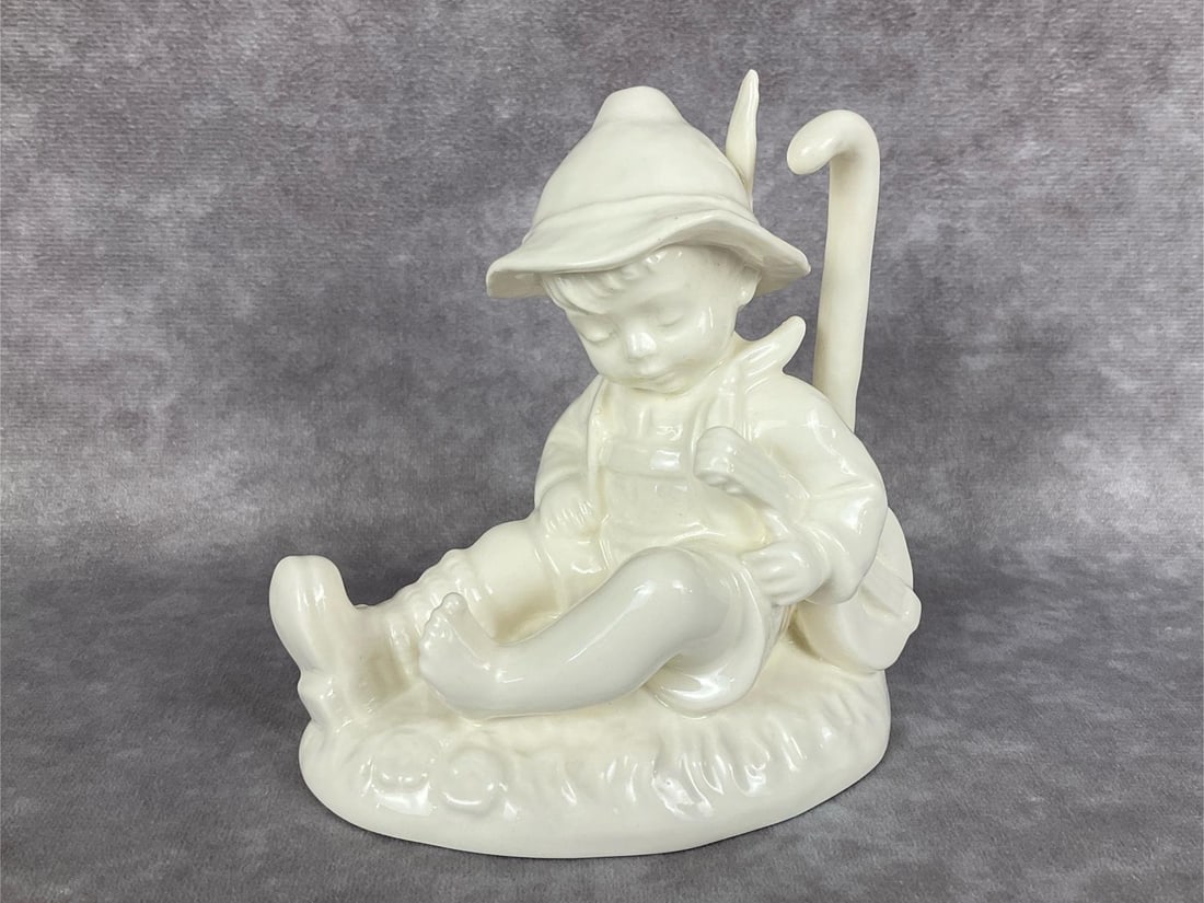 Time Out - No TM: Hum 470 in white overglaze. Incised copyright date of 1986 but no backstamp. Archive Gallery sticker attached. 4.5 inches tall. Good condition