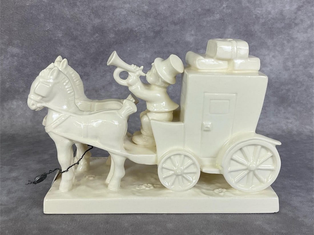 The Mail Is Here - Arbeitsmuster: Hum 226 in white overglaze with TMK 3. Metal medallion that reads W. Goebel Oeslau/Arbeitsmuster attached to legs of horses. 4.5 inches tall. Tiny chip in base bottom, otherwise good condition.