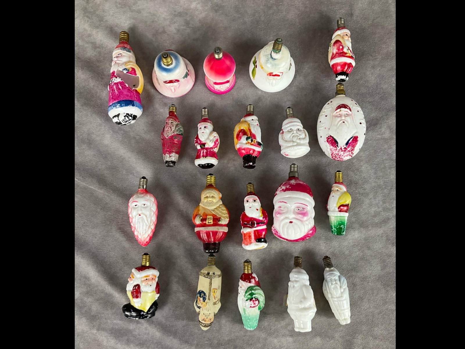 Figural Santa Claus Glass Light Bulbs: Variety of styles. Many show paint loss. One is busted and another has a loose screw in. Some marked Japan. Untested. Average 3 inches.