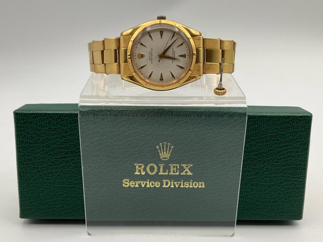 1954 Rolex 18k Gold Oyster Perpetual Men's Wristwatch: Watch and band are 18k gold ( marked 750 ). Model 6285. Has a loose stem that is included. Due to this the watch has not been tested for functionality. Serial number 47862 dates it to 1954. Round with