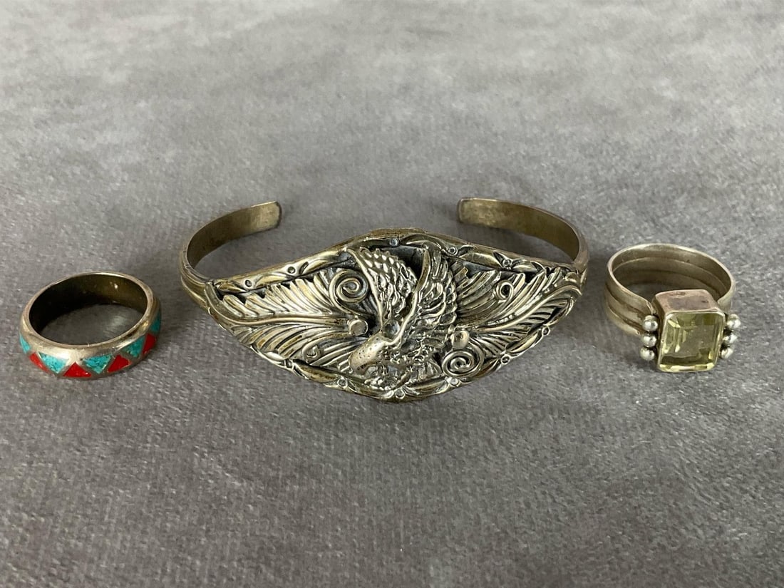Native American Sterling Eagle Cuff Bracelet: Stamped LH Sterling. 2.25 inch inner diameter. Red and blue ring, size 6.5, stamped sterling. Ring with cabochon is marked 925, size 6.5. All in good condition. Cuff is 0.63 ozt.