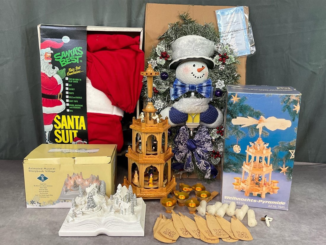 Christmas Decor: Thomas Kinkade lighted snowman wreath with original tags and COA, 25 inches tall x 15 inches wide. 1960s or 70s complete Santa Suit in original box. German Weihnachts Nativity Pyramid, complete with b