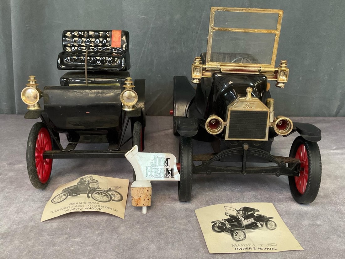 Jim Beam Commemorative Car Decanters: Made in the 1970s. 1904 curved dash Oldsmobile, minor rust to metal fenders, steering column is loose and comes off. Ford Model T, rust to metal underneath, missing the fold up roof attached to the ba