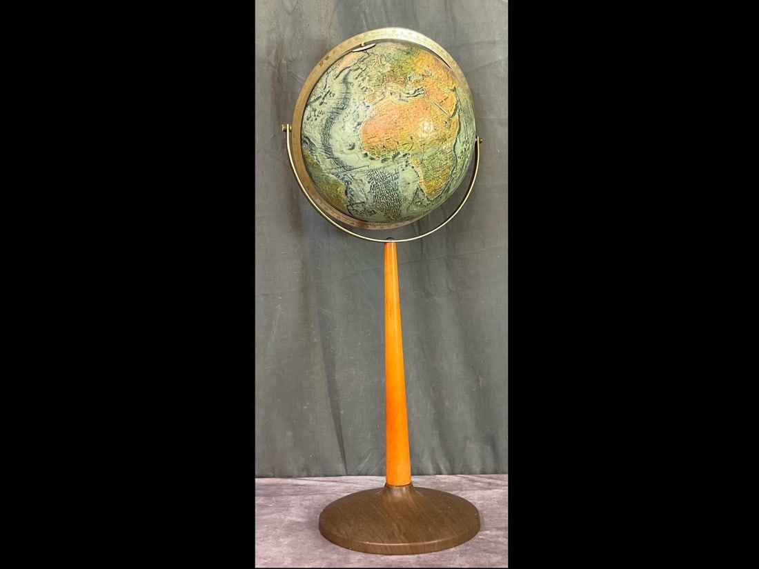 Replogle Pedestal Globe: World Ocean Series. Rotating axis. Twelve inch globe with 32 inch pedestal height to top of globe. Pedestal is wood and metal. LeRoy M. Tolman, cartographer. Good condition.