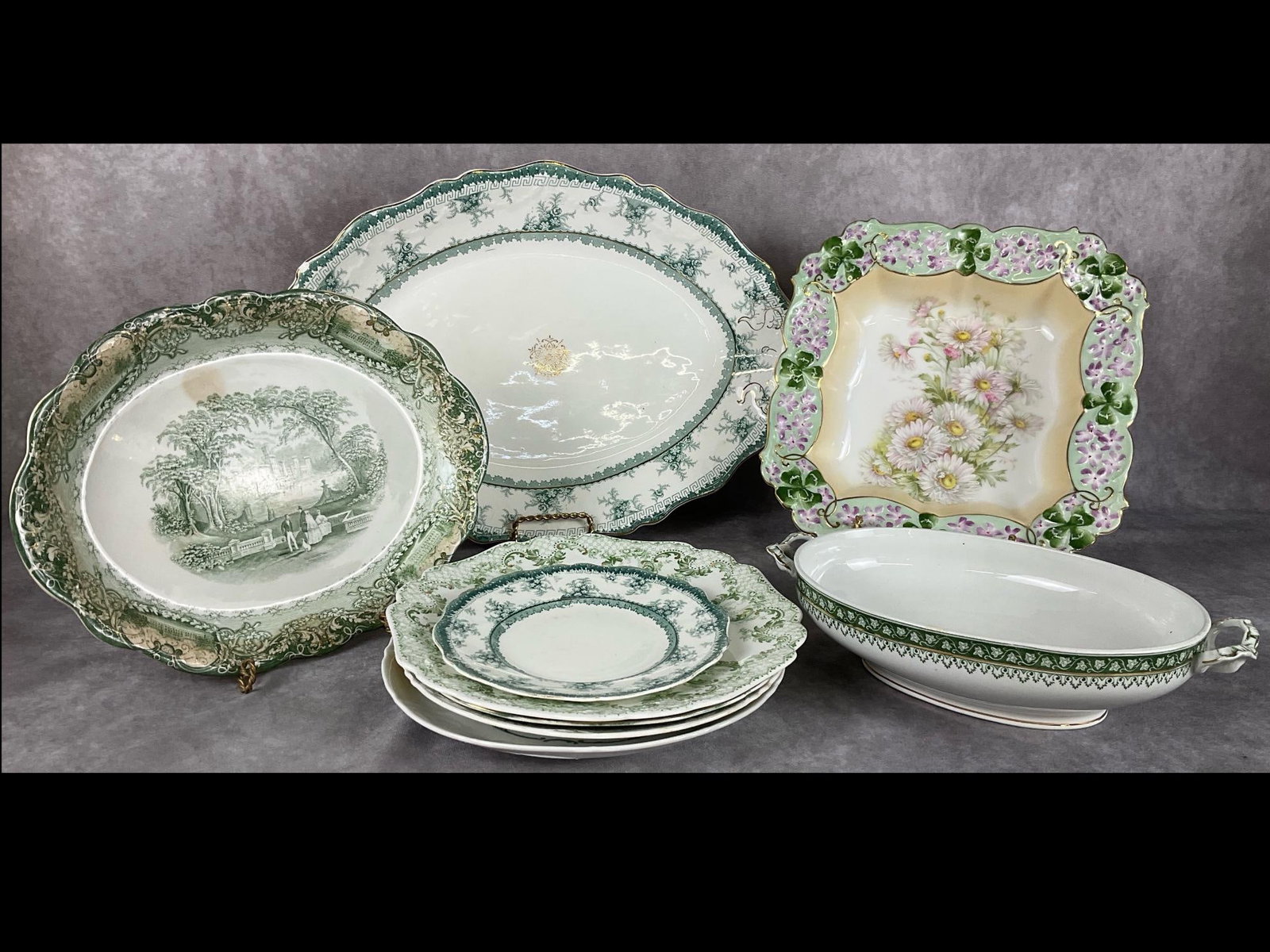 Shades of Green Porcelain Lot: Eight pieces including handpainted with gold trim serving dish measuring 10.5 inches , Maddock Royal Vitreous Hamilton serving platter measuring 12 x 12 inches, Ridgeway serving dish, Stratford porcel