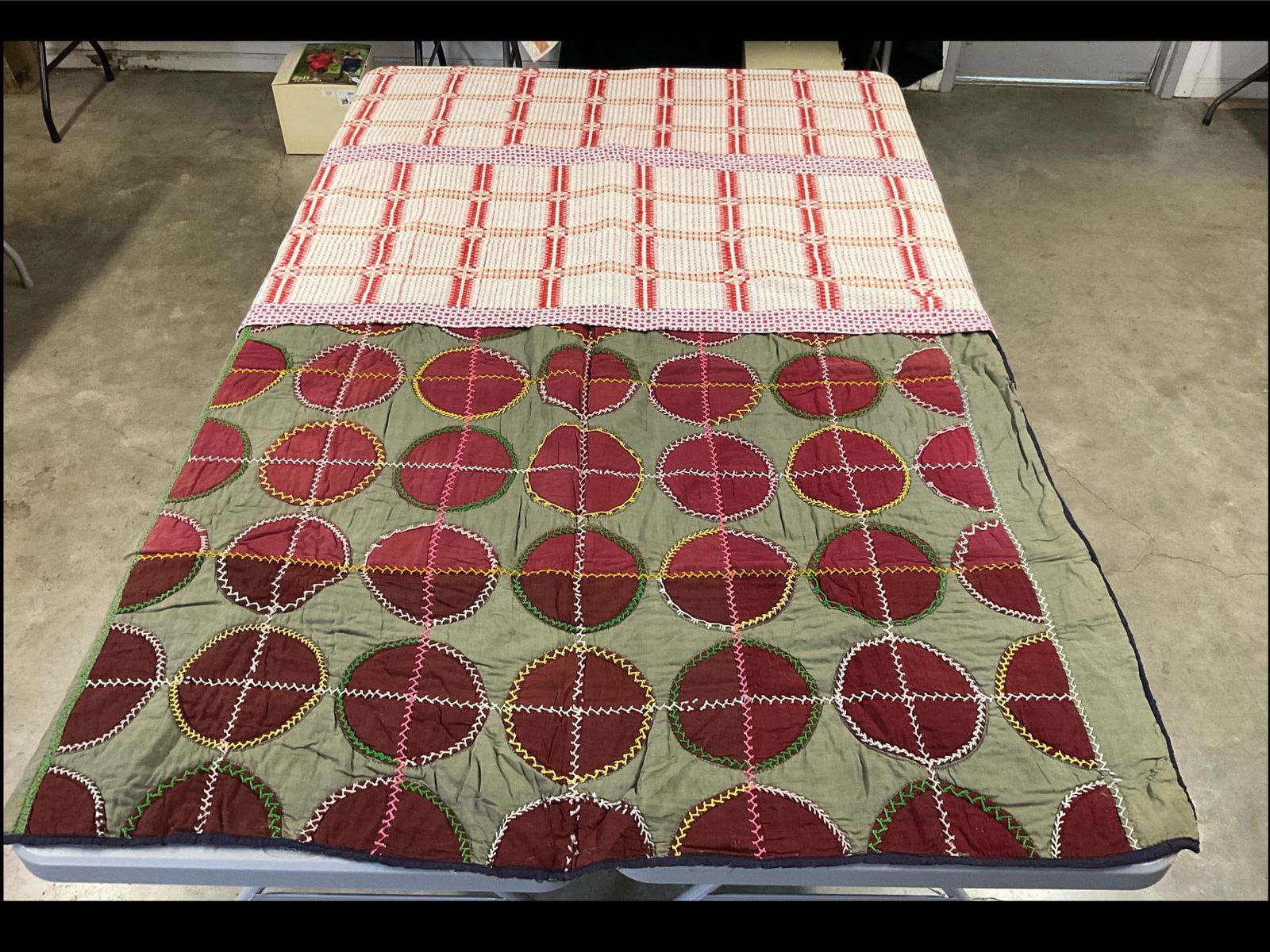Quilt & Coverlet: Older coverlet pieces have had newer machine stitched fabric added to the center and sides. Good condition. 77 x 57 inches. Second quilt is of the utility variety. The circles are hand stitched with y
