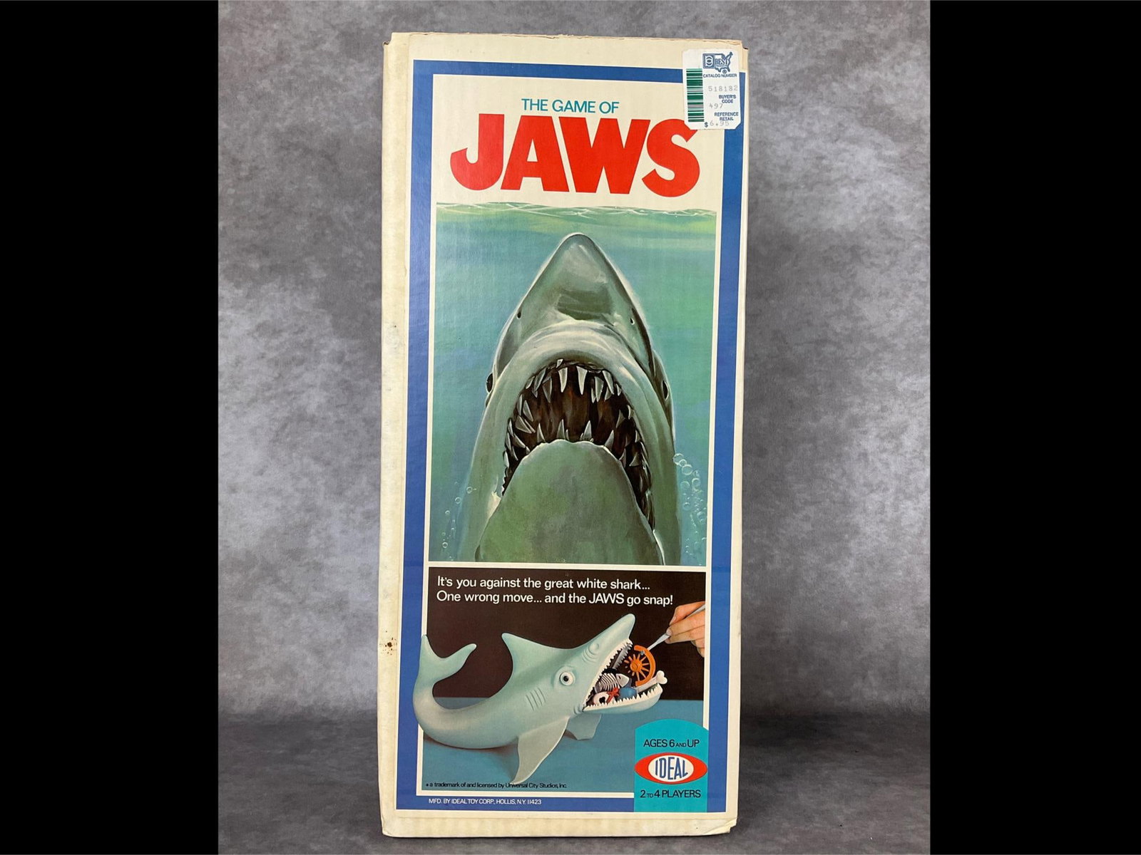 The Game of Jaws: By Ideal Toy Corp., dated 1975. Assembled, appears to be complete. Shark shows signs of age and use; rubber band that held one fin is unattached, instruction booklet is torn, and box is worn, but stil
