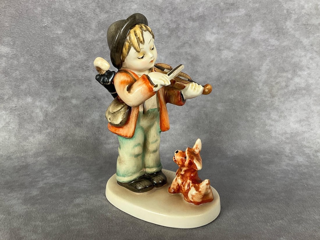 Puppy Love - Early Model: Hum 1 rare early version with head tilted at different angle and without the typical tie. Incised mold number only, no trademark present. M.I. Hummel signature incised on top of base. 5 inches tall. P