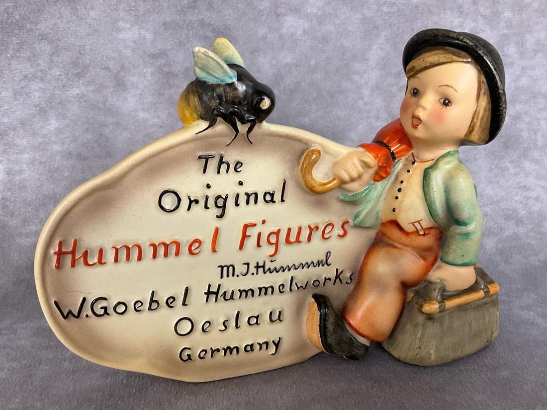 Dealer’s Plaque - Miller Collection: Hum 211 rare painted M.I. Hummel Dealer Plaque from The Miller Collection ; as seen in the price guide, and with sticker on back designating this as being an Authentic Figurine from the Private Collec