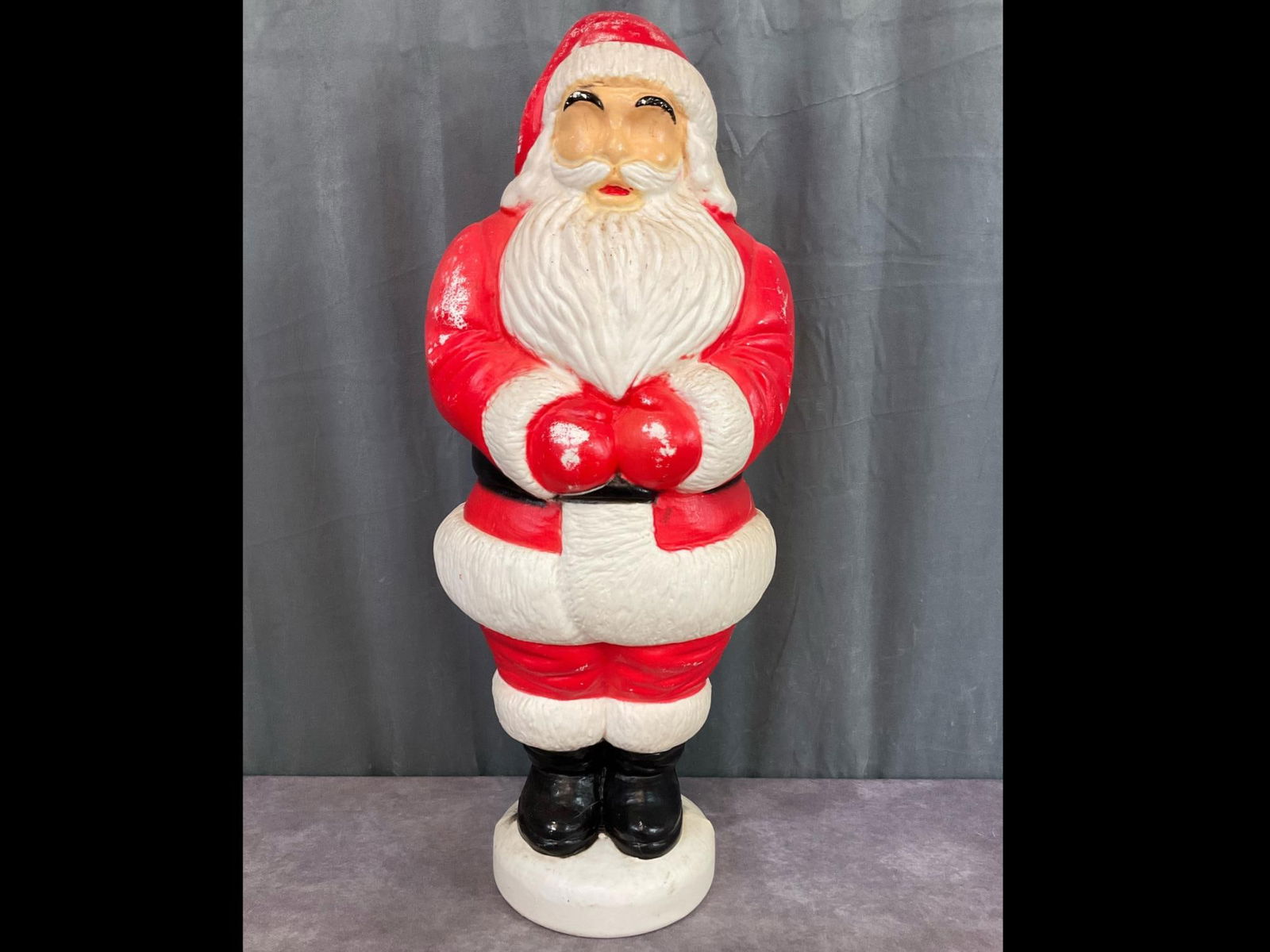 Santa Claus Blow Mold: Unmarked and stands 32 inches tall. Missing light and has paint loss all over.