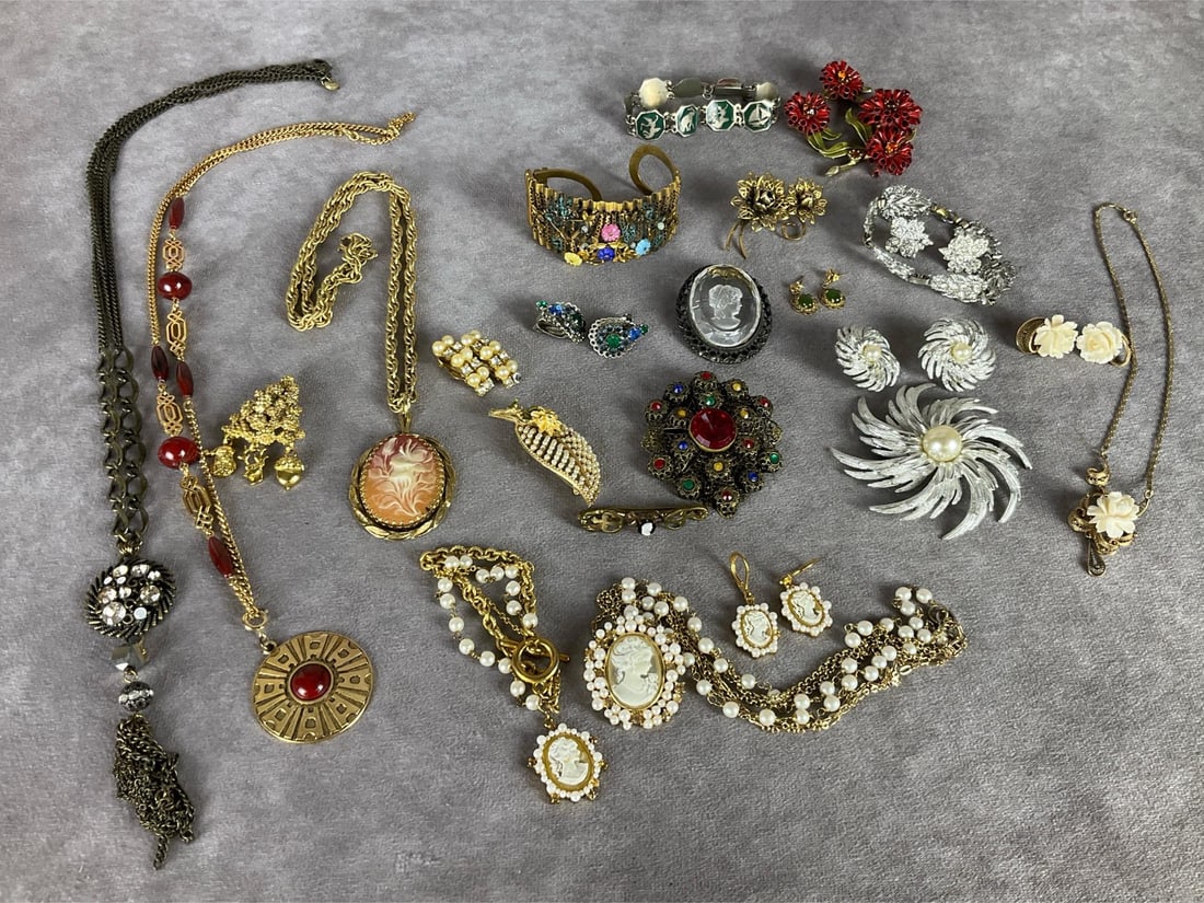 Costume & Fashion Jewelry: Pieces by Sarah Coventry, Amerique and BSK. Cameo necklace, bracelet, and earrings are made by Danbury Mint. Dress clip, gold filled pieces, faux cameos, and more. Most earrings are clip on. One pair