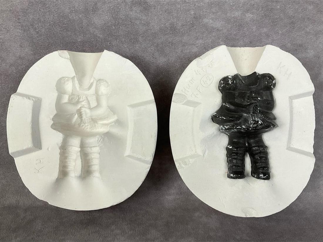 Goose Girl Mold: Plaster mold with black cast inside of the back side of Goose Girl. Incised on one side: Hum 47/0, KH, ZF, and 42. Red line encircles border on both halves. Several chips on edges as shown. Closed dim