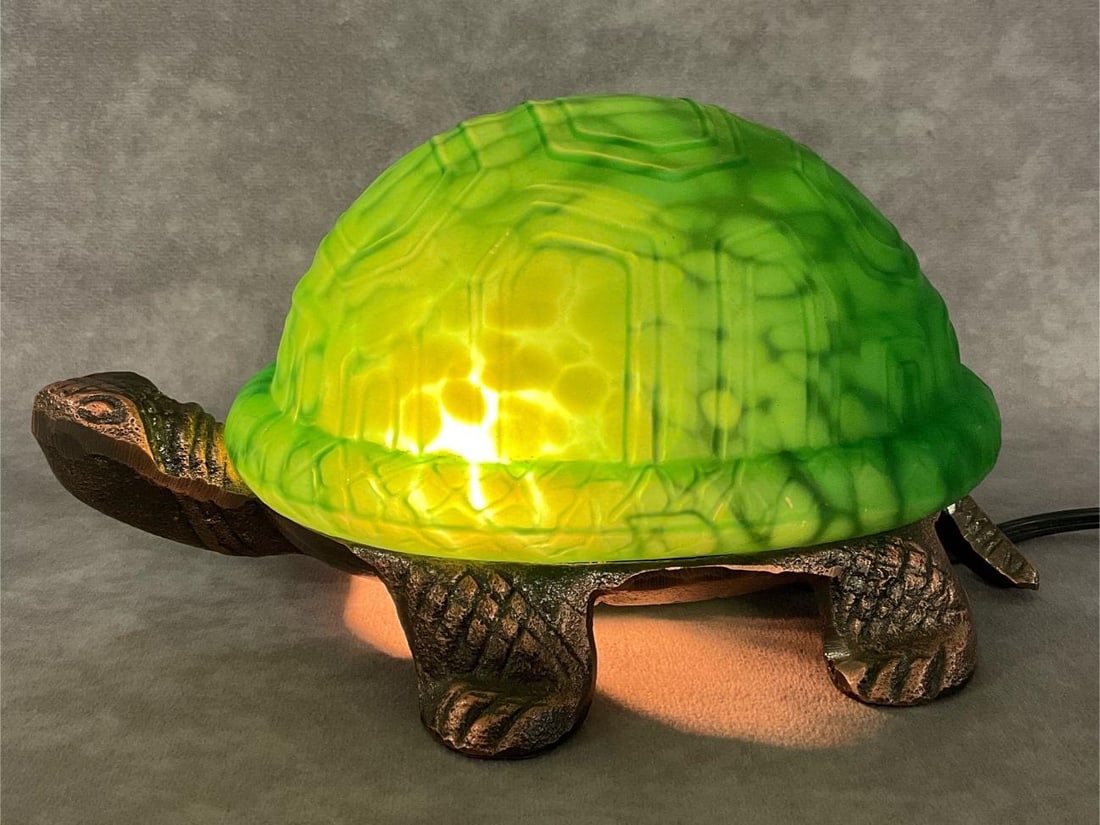 Turtle Accent Lamp: Green mottled glass shade on cast metal base. Corded electric, powers on. Good condition. 8.5 inches long x 5.5 inches wide x 4.25 inches tall.