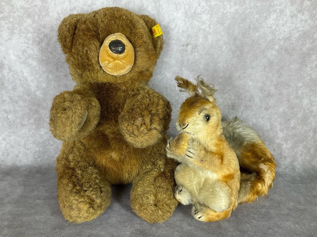 Steiff Animals: Possy squirrel with acorn. 8 inches tall. The tail wire is loose and so the tail doesn't stay wrapped around the back of the body. Some minor wear to the mohair fur. She is missing tag and ear button.