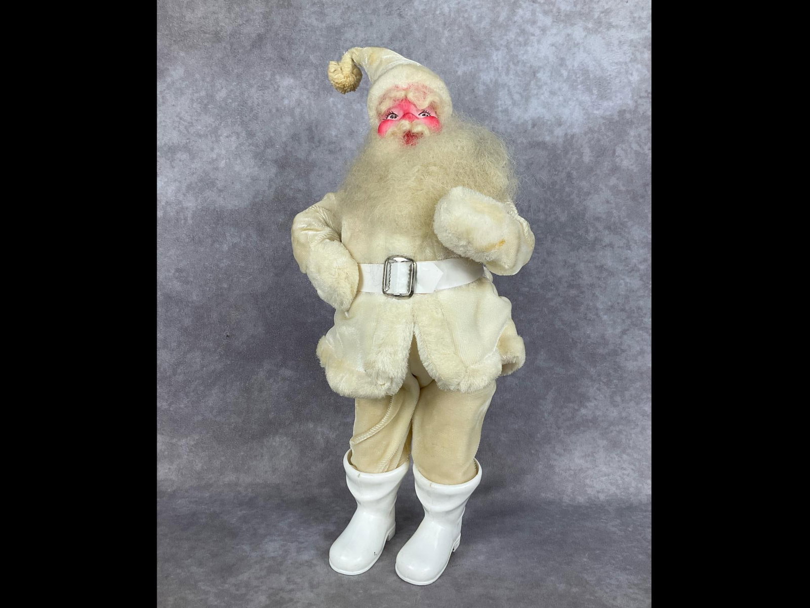 Department Store Santa: Circa 1960s composite figure with foam body, plastic boots, and synthetic velveteen ivory suit. Attributed to a Harold Gale department store display Santa. 14.5 inches tall. Some staining to hat and d