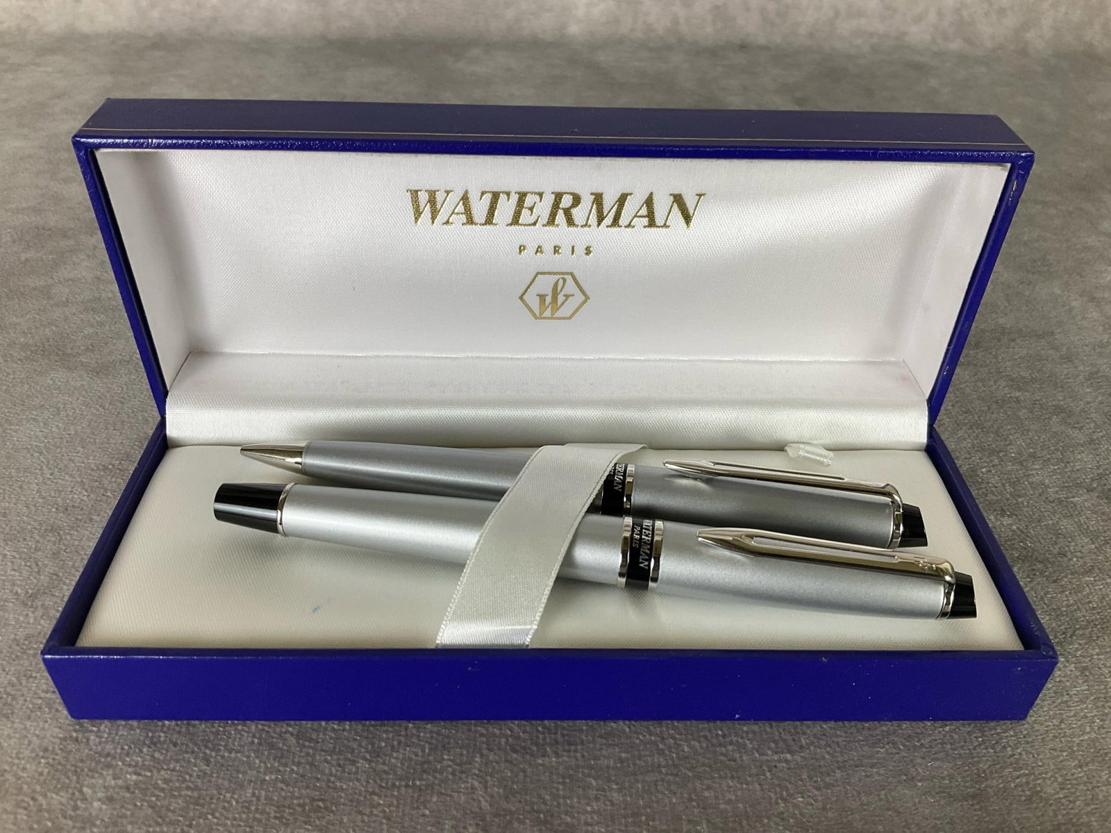 Waterman Fountain and Ballpoint Pen Set: In presentation box. Both appear to have seen little to no use. Fountain is 5.5 inches wide.