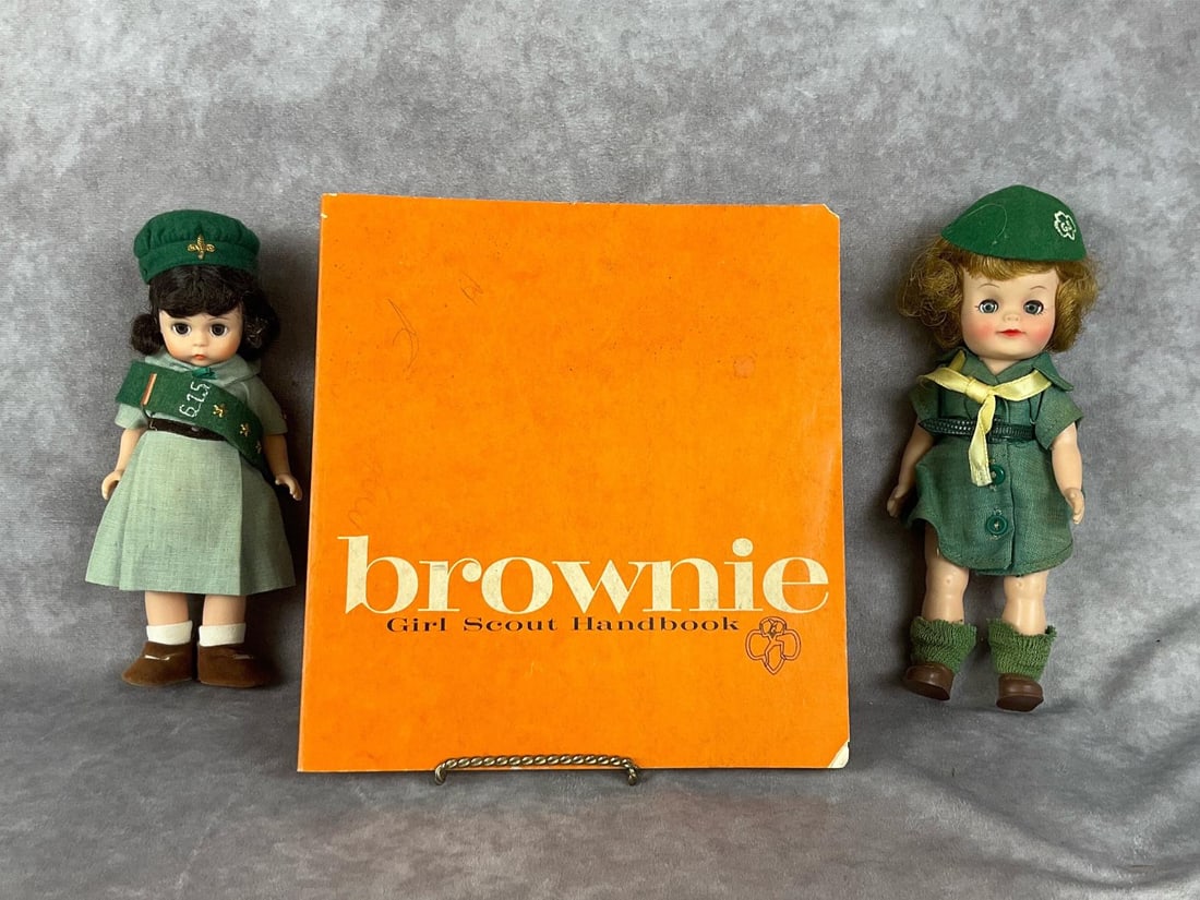 Girl Scout Brownie Collectibles: 1960's Effanbee 8 inch Girl Scout doll in good condition, some discoloration on dress due to age, socks are stretched out. Madame Alexander Scouting doll, in good condition and appears complete. Brown